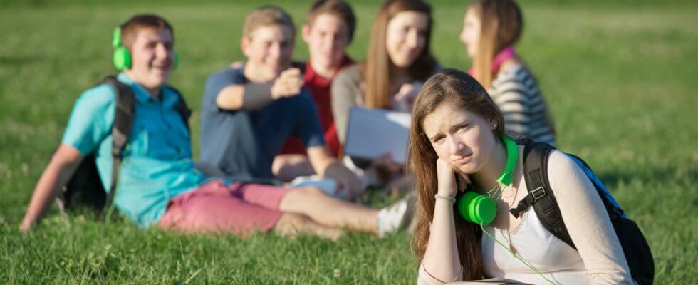 Frustrated Teen Near Group